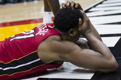 Miami Heat center Hassan Whiteside (21) reacts after being fouled by Milwaukee Bucks Malcolm Brogdon (13) in the second quarter on Sunday, Jan. 14, 2018 at the AmericanAirlines Arena in Miami, Fla. (Matias J. Ocner\/Miami Herald\/TNS)