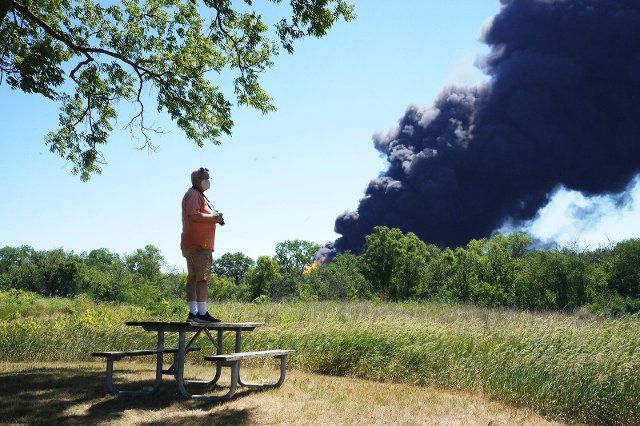 Neal Nuber, of South Beloit, watches the chemical fire at Chemtool Incorporated factory from the J.Norman Jensen Forest Preserve in South Beloit on June 14, 2021. (Stacey Wescott\/Chicago Tribune\/TNS