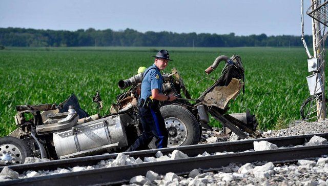 Several cars of an Amtrak train traveling from Los Angeles to Chicago derailed Monday afternoon after it struck a dump truck at a crossing in northern Missouri, Amtrak announced. More than 200 people were on board the train at the time of the crash, which was first reported at about 12:43 p.m. near Mendon, Missouri, according to the Missouri State Highway Patrol. Three people were killed in the crash, the patrol said, including two people on the train and one person in the dump truck. (Rich Sugg\/The Kansas City Star\/TNS