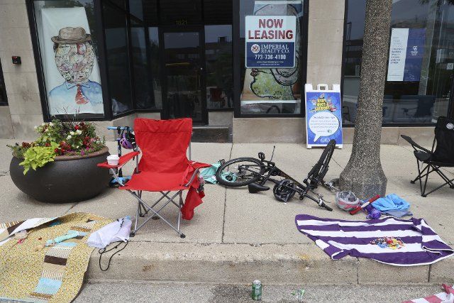 Toppled over chairs, bottles of water and other belongings left by people fleeing the shooter along St. John Ave., near the scene of the shooting in Highland Park, Monday, July 4, 2022. (Antonio Perez\/Chicago Tribune\/TNS
