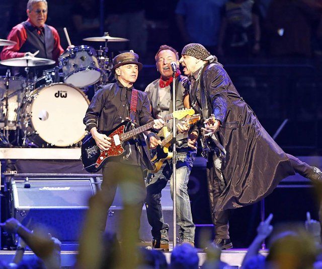 Bruce Springsteen, center, sings with Nils Lofgren and Steven Van Zandt as the E Street Band plays at the BB&T Center in Sunrise, Florida, Feb.16, 2016. (Charles Trainor Jr.\/Miami Herald\/TNS