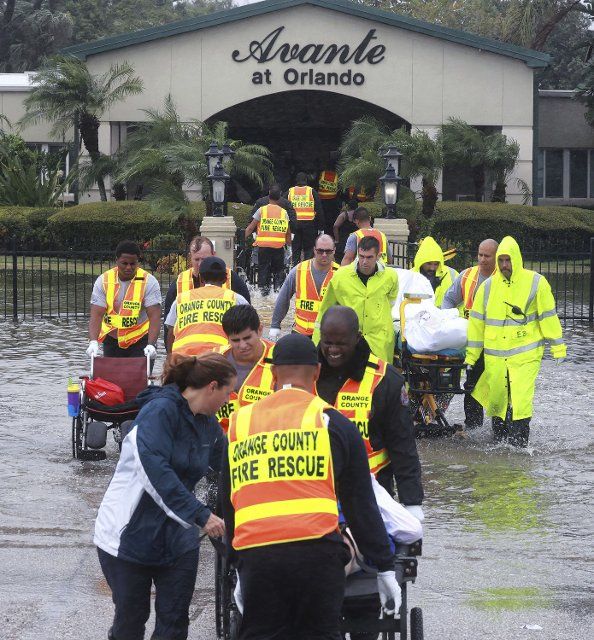 A resident of Avante At Orlando, a nursing home on Semoran Boulevard, is evacuated from flood waters in the wake of Hurricane Ian on Sept. 29, 2022. (Joe Burbank\/Orlando Sentinel\/TNS
