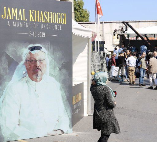 A photo of Jamal Khashoggi is posted at the venue of an event in Istanbul on Oct. 2, 2019, to mark the first anniversary of the murder of the Saudi Arabian journalist. (Kyodo) ==Kyodo