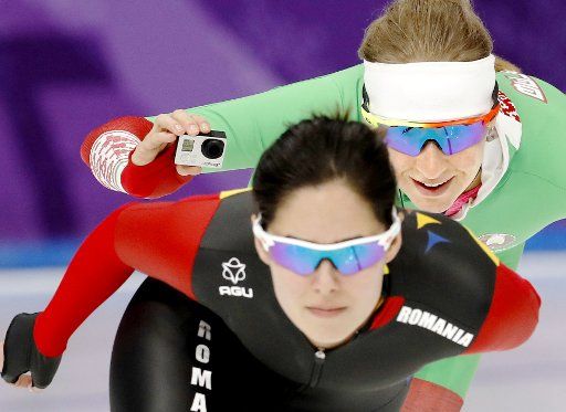 A Belarusian speed skater (back) takes a selfie with a fellow speed skater from Romania at a training site in Gangneung, South Korea, during the Pyeongchang Winter Olympics on Feb. 23, 2018. (Kyodo) ==Kyodo