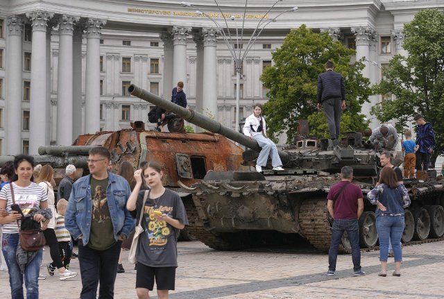 People gather at a square in Kyiv, where destroyed Russian tanks and armored vehicles have been put on display, on June 5, 2022. (Kyodo) ==Kyodo