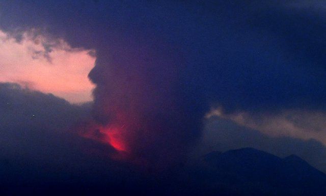 Photo taken from a fixed camera in the Kagoshima Prefecture city of Tarumizu, southwestern Japan, shows Sakurajima volcano erupting on July 24, 2022. Sakurajima is connected to the Osumi Peninsula of Kyushu, Japan\