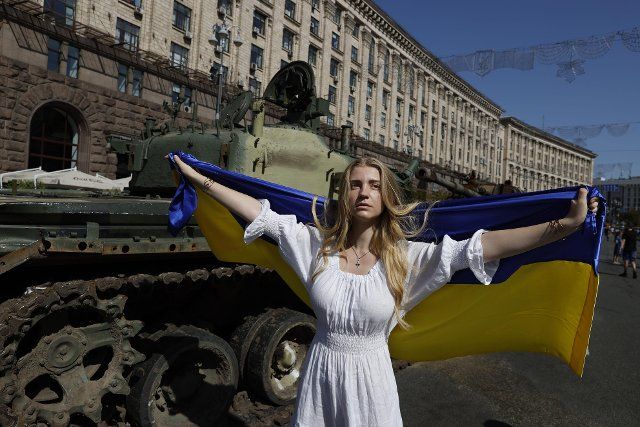 A woman holds Ukraine\