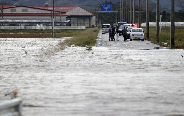 A road is seen flooded in Saito in Miyazaki Prefecture on Sept. 19, 2022, as Typhoon Nanmadol slammed the southwestern Japan region. (Kyodo) ==Kyodo