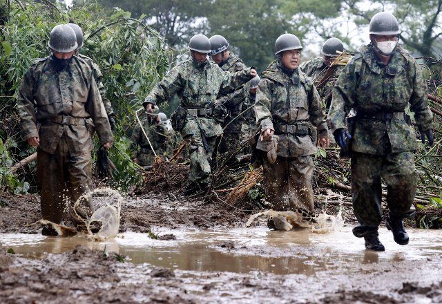 Japan Ground Self-Defense Force personnel search for a man missing at the site of a mudslide in Mimata in Miyazaki Prefecture, on Sept. 19, 2022, as Typhoon Nanmadol slammed the southwestern Japan region. (Kyodo) ==Kyodo