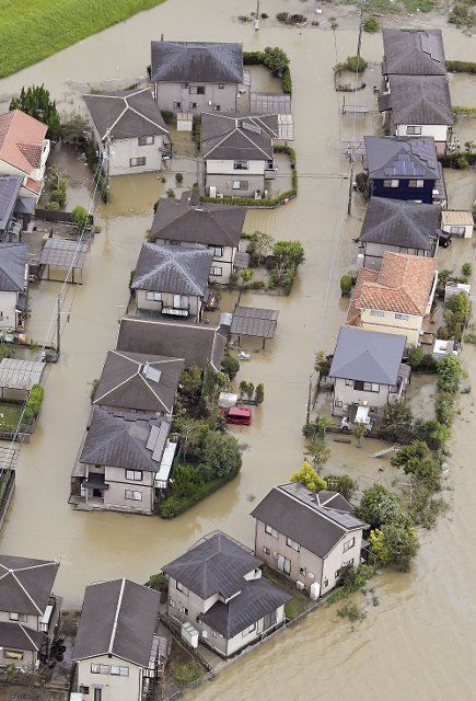 Photo taken from a Kyodo News helicopter shows a flooded residential area in Kunitomi in Miyazaki Prefecture on Sept. 19, 2022, as Typhoon Nanmadol slammed the southwestern Japan region. (Kyodo) ==Kyodo