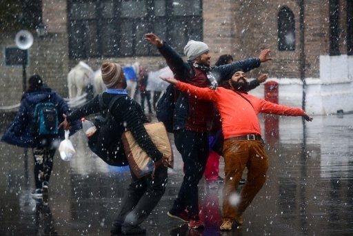 SHIMLA, INDIA - JANUARY 23: Tourists enjoy the seasonâs first snowfall at Ridge, on January 23, 2018 in Shimla, India. (Photo by Deepak Sansta\/Hindustan Times )