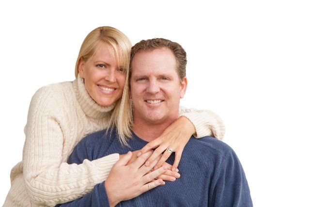Happy attractive caucasian couple isolated on a white