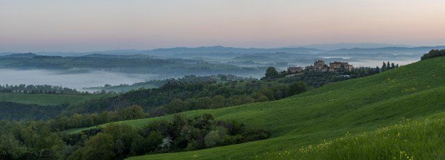 Foggy atmosphere in hilly landscape, province of Siena, Tuscany, Italy