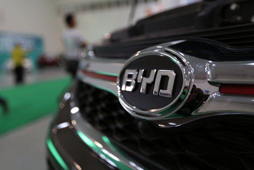 --FILE--View of a logo of BYD during an automobile exhibition in Haikou city, south China\