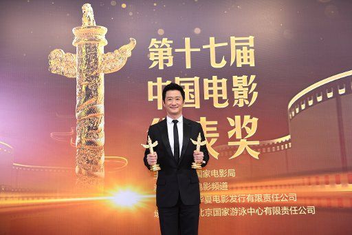 Chinese actor and director Wu Jing poses with his trophy after winning the Outstanding Actor award at the 17th Huabiao Film Awards in Beijing, China, 8 December 2018.