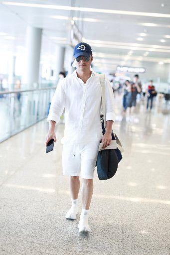 Chinese actor and director Wu Jing arrives at the Shanghai Hongqiao International Airport before departure in Shanghai, China, 24 June 2019.