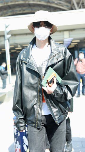 Chinese actor Zhang Yunlong, also kown as Leon Zhang, arrives in an airport in Beijing, China, April 16, 2020. Shoes: Louis