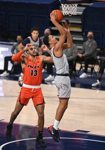 SPOKANE, WA - JANUARY 23: Gonzaga Gonzagaard Jalen Suggs (1) goes up to score as Pacific forward Jeremiah Bailey (13) looks on during the game between the Pacific Tigers and the Gonzaga Bulldogs played at the McCarthey Athletic Center on January 23, 2021 in Spokane, Washington. (Photo by Robert Johnson\/Icon Sportswire