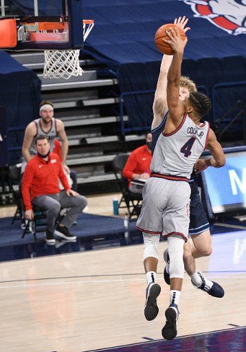 SPOKANE, WA - FEBRUARY 20: Gonzaga Gonzagaard Aaron Cook (4) goes up to throw down a dunk while being fouled by San Diego forward Ben Pyle (33) during the game between the San Diego Toreros and the Gonzaga Bulldogs played at the McCarthey Athletic Center on February 20, 2021 in Spokane, Washington. (Photo by Robert Johnson\/Icon Sportswire