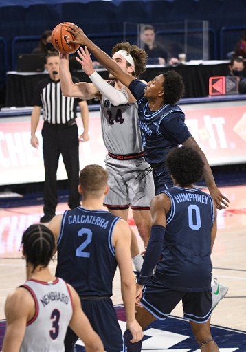 SPOKANE, WA - FEBRUARY 20: San Diego Gonzagaard Frankie Hughes (3) is called for a foul on Gonzaga forward Corey Kispert (24) despite getting a lot of ball on this block during the game between the San Diego Toreros and the Gonzaga Bulldogs played at the McCarthey Athletic Center on February 20, 2021 in Spokane, Washington. (Photo by Robert Johnson\/Icon Sportswire