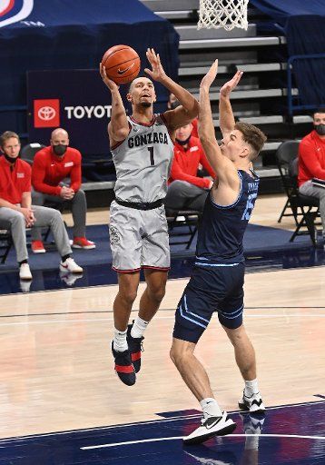 SPOKANE, WA - FEBRUARY 20: Gonzaga Gonzagaard Jalen Suggs (1) scores as San Diego center Vladimir Pinchuk (15) defends during the game between the San Diego Toreros and the Gonzaga Bulldogs played at the McCarthey Athletic Center on February 20, 2021 in Spokane, Washington. (Photo by Robert Johnson\/Icon Sportswire