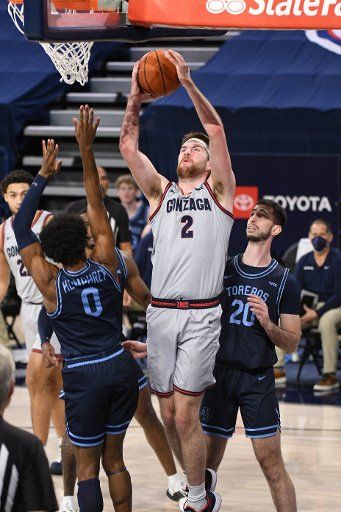 SPOKANE, WA - FEBRUARY 20: Gonzaga forward Drew Timme (2) goes up to score over San Diego Gonzagaard Marion Humphrey (0) during the game between the San Diego Toreros and the Gonzaga Bulldogs played at the McCarthey Athletic Center on February 20, 2021 in Spokane, Washington. (Photo by Robert Johnson\/Icon Sportswire