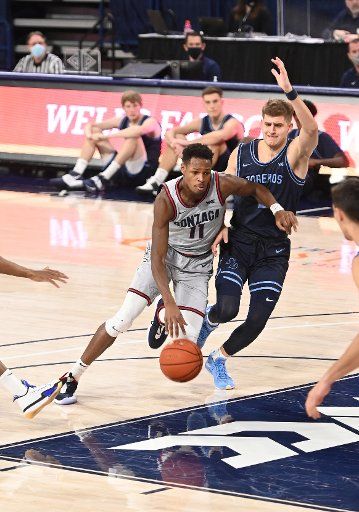 SPOKANE, WA - FEBRUARY 20: Gonzaga Gonzagaard Joel Ayayi (11) drives past San Diego Gonzagaard Joey Calcaterra (2) during the game between the San Diego Toreros and the Gonzaga Bulldogs played at the McCarthey Athletic Center on February 20, 2021 in Spokane, Washington. (Photo by Robert Johnson\/Icon Sportswire