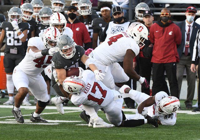 PULLMAN, WA - OCTOBER 16: Washington State running back Max Borghi (21) is brought down by Stanford linebacker Ricky Miezan (45) and cornerback Kyu Blu Kelly (17) after making a catch during the game between the Washington State Cougars and the Stanford Cardinal on October 16, 2021, at Martin Stadium in Pullman, WA. (Photo by Robert Johnson\/Icon Sportswire