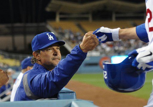 20 April 2011: Dodgers Manager Don Mattingly congratulates Dodgers (21) Jon Garland upon his return to the dugout during a Major League Baseball game between the Atlanta Braves and the Los Angeles Dodgers at Dodger Stadium in Los Angeles CA.