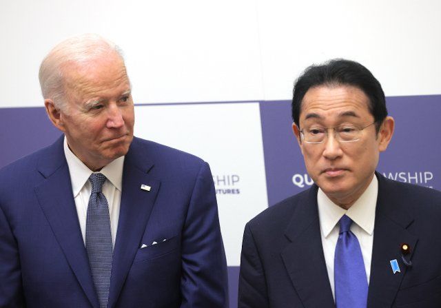 U.S. President Joe Biden, left, and Japanese Prime Minister Fumio Kishida, right, attend a commemorative event for the Quad Fellowship at the prime minister\