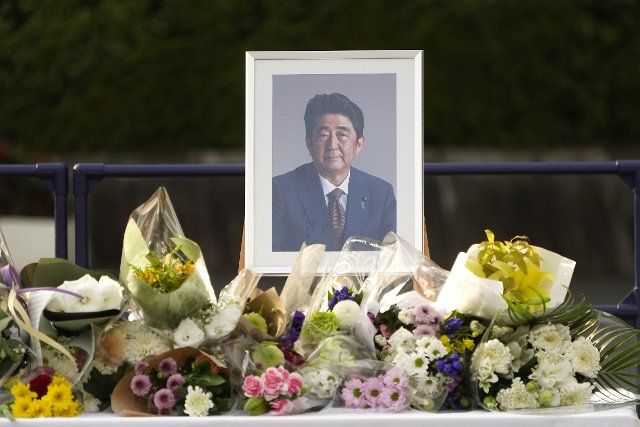 This photo taken September 27, 2022 shows flower offering stands set up at the headquarters of the Liberal Democratic Party in Tokyo, on the day of state funeral for former Prime Minister Shinzo Abe. JIJI PRESS PHOTO \/ MORIO TAGA