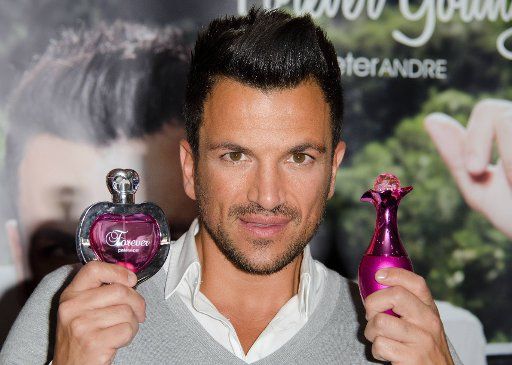 MAVRIXONLINE.COM - USA, CANADA, LATIN AMERICA AND GREECE ONLY - Peter Andre attends a photocall to launch his new fragrances for women "Forever" & "Forever Young" at The Perfume Shop on Oxford Street in London, UK. 4th September 2013.