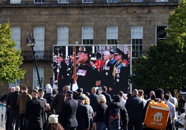 Hundreds turn out to watch the funeral of Queen Elizabeth II on a large screen at Old Eldon Square, Newcastle. 19th September