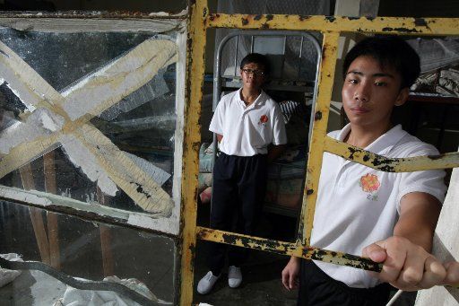 Law Hin-yiu (L), 19-year-old and Chok Ho-yin, 17-year-old, pose for the photographer at the Christian Zheng Sheng College in Lantau Island.