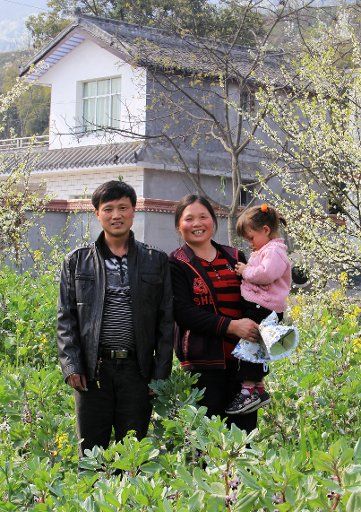Home for Hope: Grandfather Yin Jianhua, grandmother Zheng Yongrong and granddaughter Feng Xiangyi at New Qingquan village.