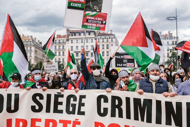 Several hundred people gathered at Place Bellecour in Lyon, France, then demonstrated in the streets of Lyon to support the Palestinian people against Israel. The demonstrators protested about the violence during the conflict between Israel and Palestine, especially in the Gaza Strip, which began on May 10, 2021. Today Israel and Hamas reached an agreement for a ceasefire after ten days of deadly clashes. But the tension remains high in East Jerusalem. France, Lyon, May 22, 2021\/\/KONRADK_konrad-024\/2105221845\/Credit:KONRAD K.\/SIPA