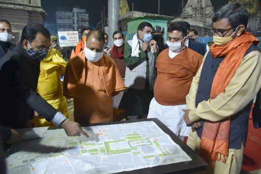VARANASI, INDIA - DECEMBER 21: UP Chief Minister Yogi Adityanath during his visit for inspection of progress of Vishwanath Temple corridor on December 21, 2020 in Varanasi, India. Uttar Pradesh Chief Minister Yogi Adityanath inspected the construction work of Kashi Vishwanath Corridor, a dream project of PM Modi and offered prayer at Kashi Vishwanath Temple. One of the most challenging projects so far has been the development of a 50-feet-wide Kashi Vishwanath Corridor To ease the pilgrimage. (Photo by Rajesh Kumar\/Hindustan Times\/Sipa USA