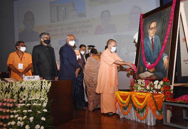 LUCKNOW, INDIA - JUNE 29: Chief Minister Yogi Adityanath pays floral tribute to Dr Bhimrao Ambedkar during the foundation stone for Dr Bhimrao Ambedkar Memorial and Cultural Centre in the presence of Governor of Uttar Pradesh Anandi Ben Patel and Chief Minister Yogi Adityanath, at Lok Bhawan, on June 29, 2021 in Lucknow, India. (Photo by Deepak Gupta\/Hindustan Times\/Sipa USA