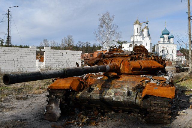 A destroyed Russian tank stands by the road in front of an orthodox temple in the liberated town of Sviatohirsk. Russia is losing from 50 to 100 soldiers each day in the battle of Bakhmut amid its desperate attempts to capture the city in the eastern Donetsk Oblast, a military spokesman said on Dec. 4. Speaking on TV, Eastern Military Command spokesman Serhiy Cherevaty said that about as many Russian soldiers get wounded in action near Bakhmut daily. For months, Russia has massed troops and equipment to surround and capture Bakhmut in a brutal campaign participated by the Russian state-backed military company Wagner Group. (Photo by Andriy Andriyenko \/ SOPA Images\/Sipa USA