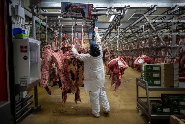 Workers in the meat pavillion at the Rungis International wholesale food market as buyers prepare for the Christmas holiday season in Rungis, south of Paris, on December 6, 2022. Photo by Blondet Eliot \/Abaca\/Sipa