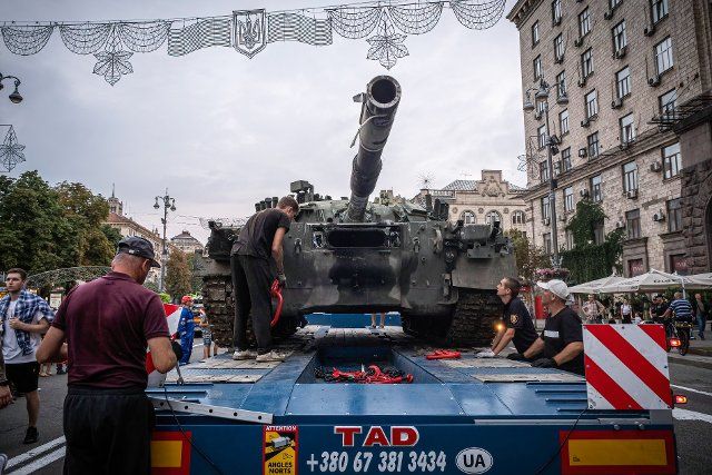 Workers transport the wreckage of a Russian tank to the exhibition in Kyiv, Ukraine. As dedicated to the upcoming Independence Day of Ukraine, and nearly 6 months after the full-scale invasion of Ukraine on February 24, the country\