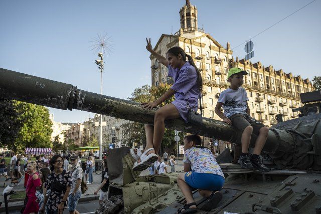 Children climb up to the wreckage of a Russian tank as people flocked to see the display of destroyed Russian military equipments on the streets of Kyiv. As dedicated to the upcoming Independence Day of Ukraine, and nearly 6 months after the full-scale invasion of Ukraine on February 24, the country\