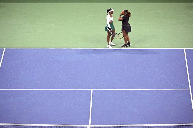 Sisters Venus Williams (l) and Serena Williams (r), of the United States, confer in their first-round doubles match against Lucie Hradecká and Linda Nosková, of the Czech Republic, during the 2022 U.S. Open tennis championships, inside Arthur Ashe stadium at at the USTA Billie Jean King National Tennis Center in Flushing Meadows Corona Park New York, September 1, 2022. (Photo by Anthony Behar\/Sipa USA