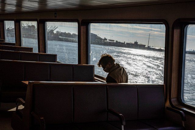 A silhouetted passenger seen inside the ferry that docked at Kadikoy pier. (Photo by Onur Dogman \/ SOPA Images\/Sipa USA