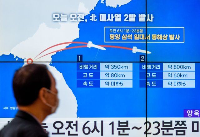 A TV screen is seen showing a news program reporting about North Korea\