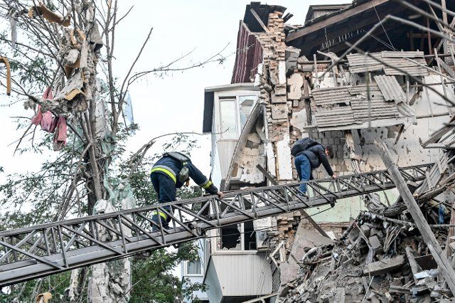 ZAPORIZHZHIA, UKRAINE - OCTOBER 06, 2022 - Rescuers work at the site of a multiple S-300 missile strike by the russian troops on Zaporizhzhia, south-eastern Ukraine. Photo by Dmytro Smoliyenko\/Ukrinform\/Abaca\/Sipa