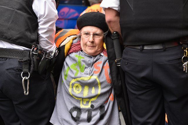 A protester is being arrested by the police during the demonstration in Westminster. Climate activists group Just Stop Oil blocked the roads around Millbank and Horseferry Road on the 5th day of Occupy Westminster action, demanding to halt all future licensing and consents for the exploration, development and production of fossil fuels in the UK. (Photo by Thomas Krych \/ SOPA Images\/Sipa USA