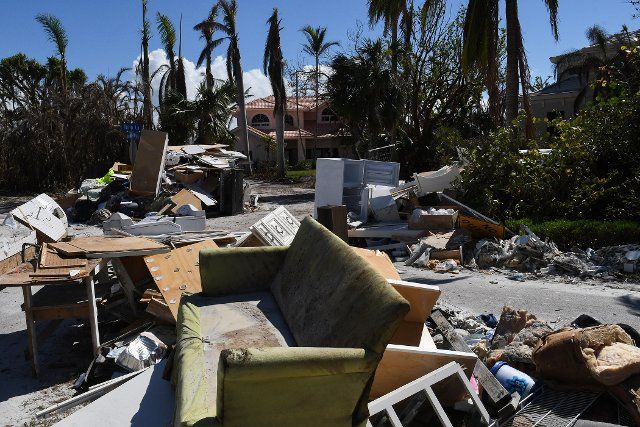 Debris, furniture, and a refrigerator from a home seen along the road in Sanibel Island, Florida over a month after Hurricane Ian made landfall as a Category 4 hurricane. The storm caused an estimated $67 billion in insured losses and at least 127 storm-related deaths in Florida. (Photo by Paul Hennessy \/ SOPA Images\/Sipa USA