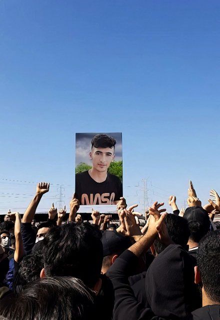 At the funeral ceremony of Kian Pirflak, people hold a photo of Hadi Bahmani was a 17 years old who was killed by Iranian security forces in Izeh, durning protest, unrest continue in Iran since the murder of Mahsa Amini, Iranians have been holding daily protests anti-regime continue with intensity. Izeh. Iran. November 18, 2022. Photo by SalamPix\/Abaca\/Sipa