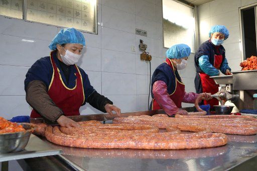 Meishan,CHINA-19th January 2018: As the Spring Festival is approaching, people are busy with making smoked pork in Meishan, southwest China\